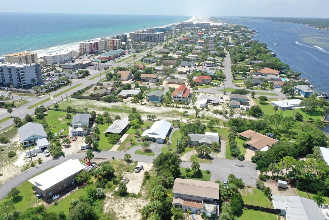 an aerial view of residential houses with outdoor space