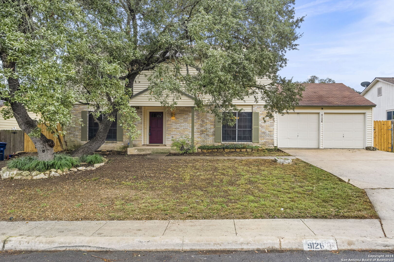 front view of a house with a yard