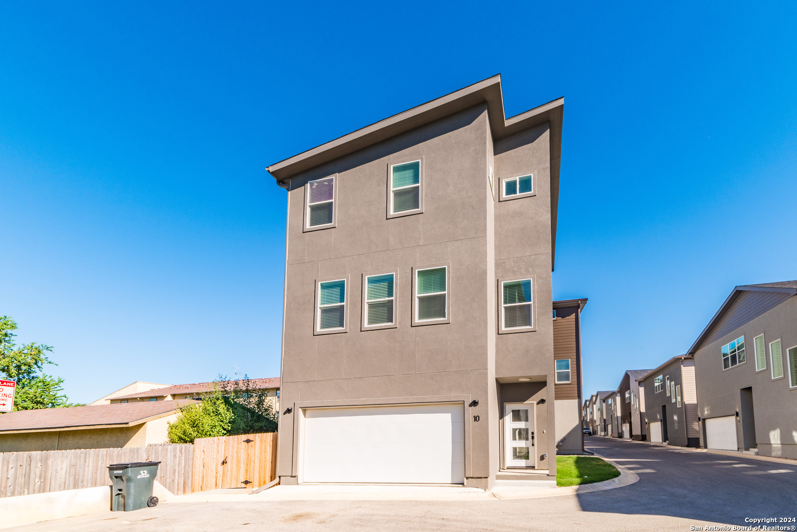 a front view of a house with street