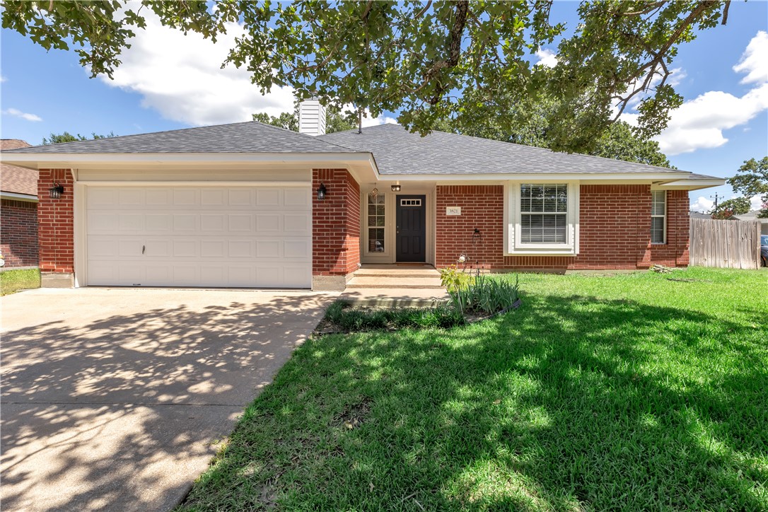 Single story home with a 2 car garage and a corner