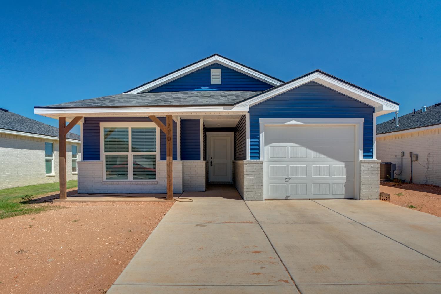 a front view of a house with a garage