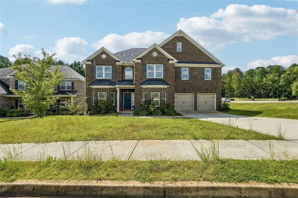 a front view of a house with a yard