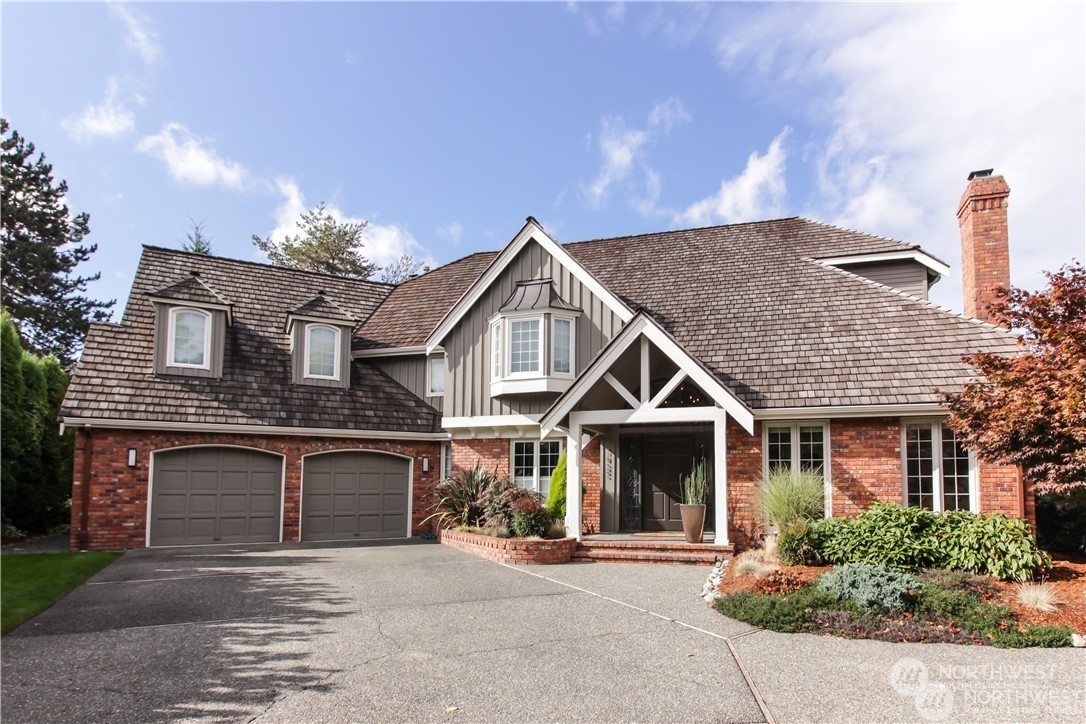 a front view of a house with yard