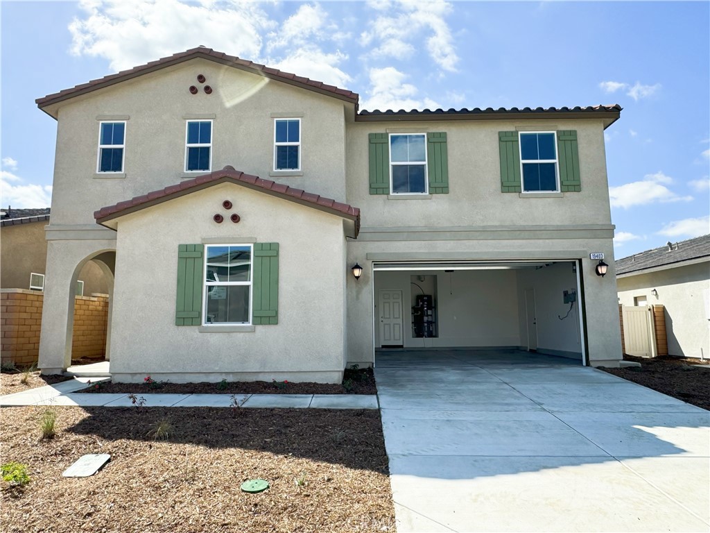 a front view of a house with a garage