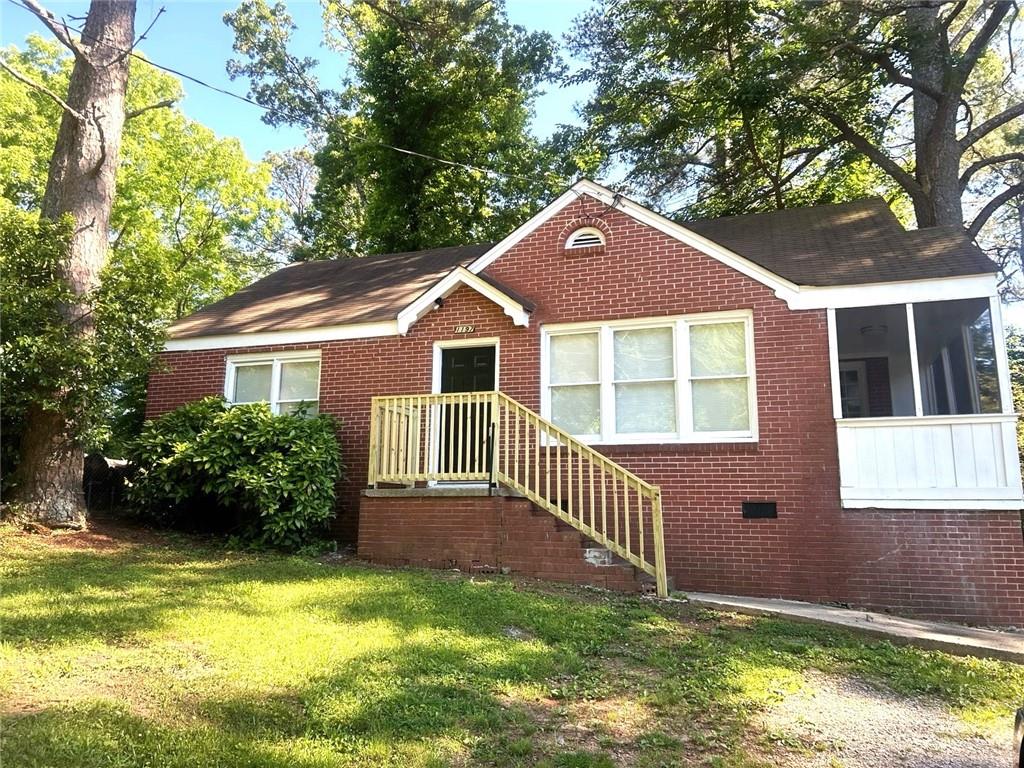 a front view of a house with garden