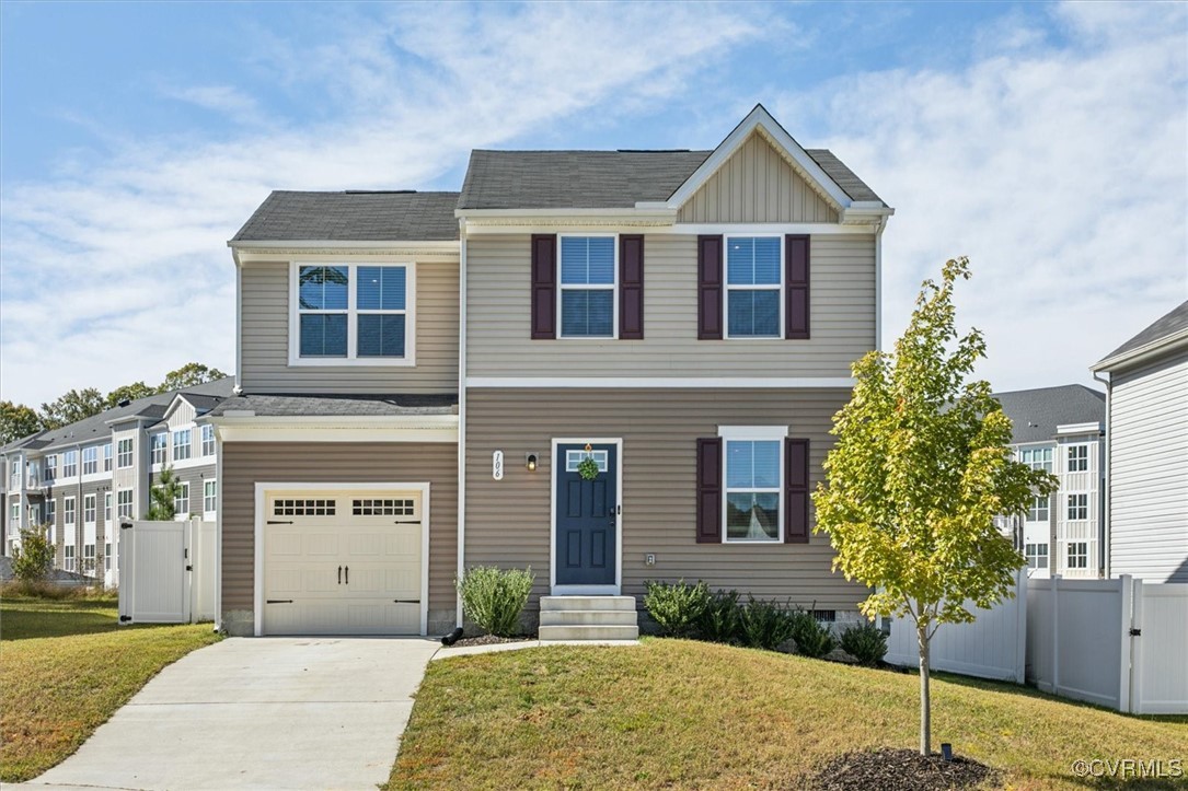 View of front of house with a garage and a front l