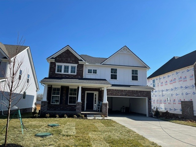 a front view of a house with garage