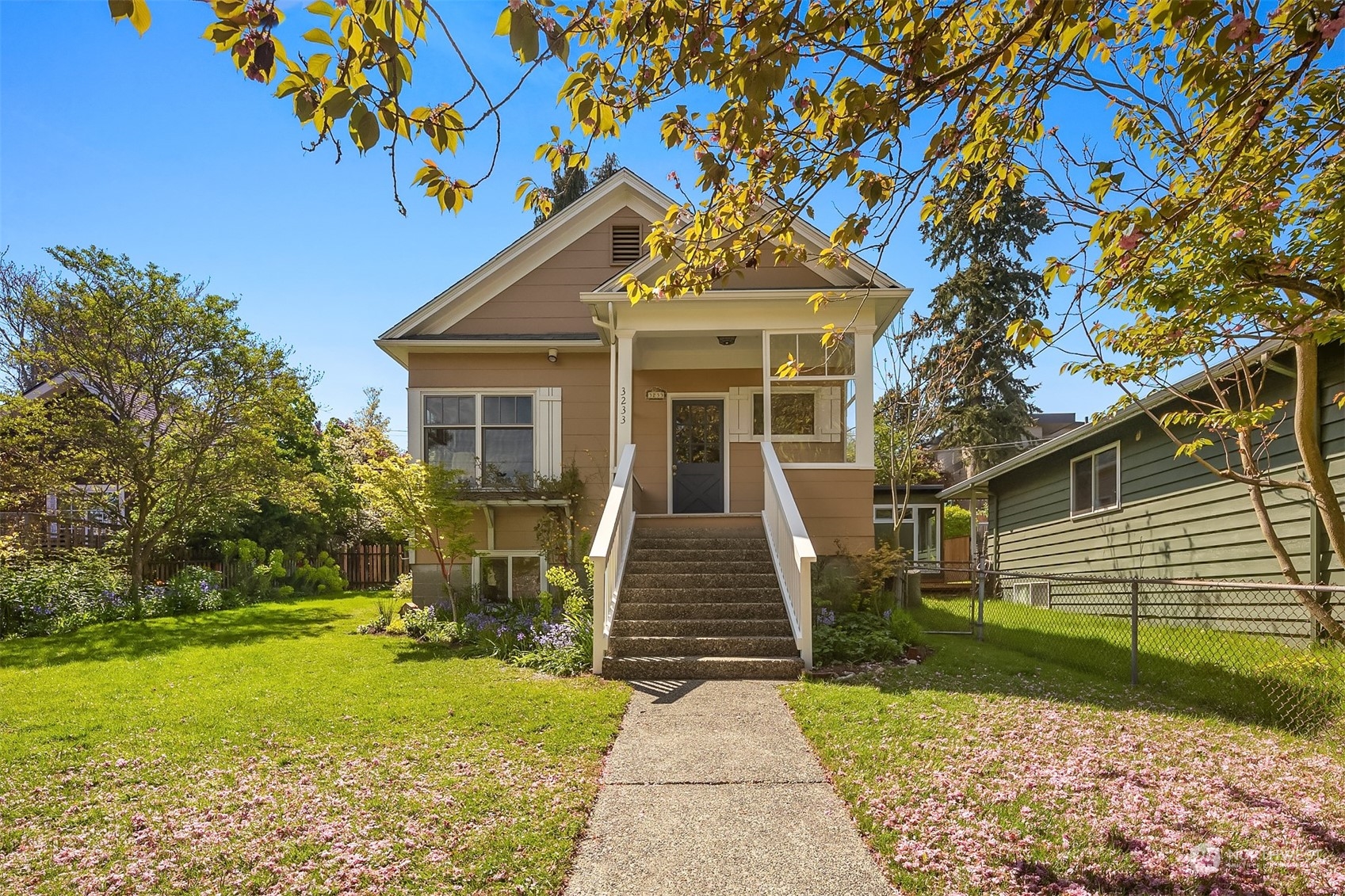 a front view of a house with garden