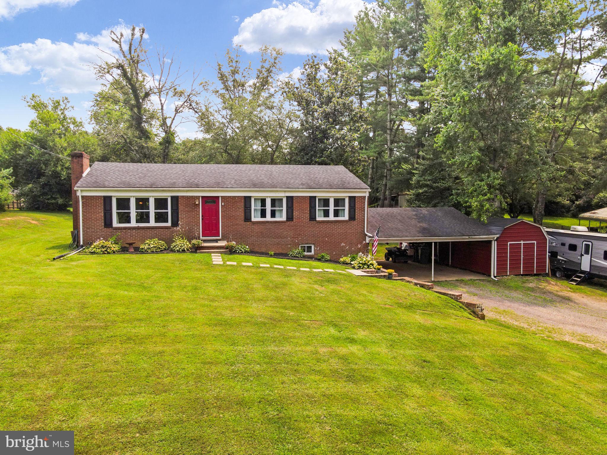 an aerial view of a house with swimming pool garden and patio