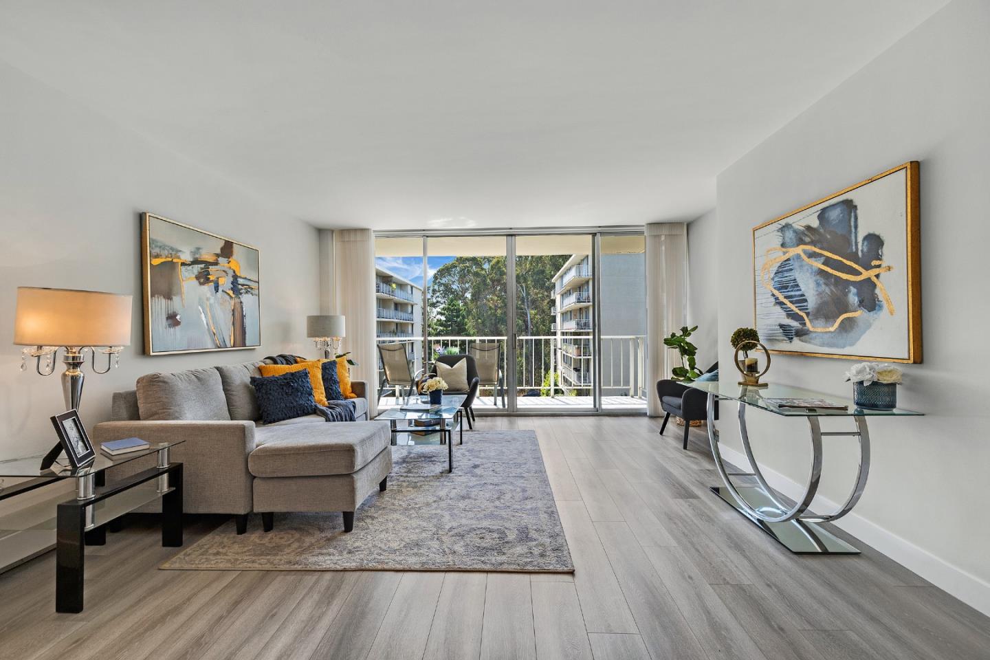 a living room with furniture and a large window