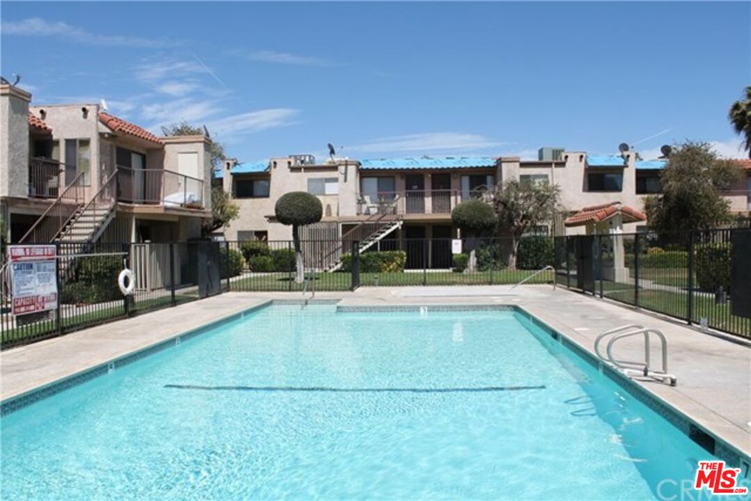 a view of a patio with swimming pool