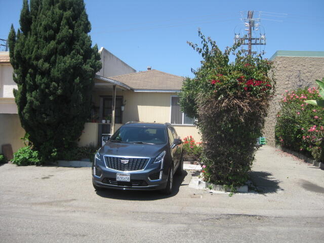 a view of a car parked in front of a house