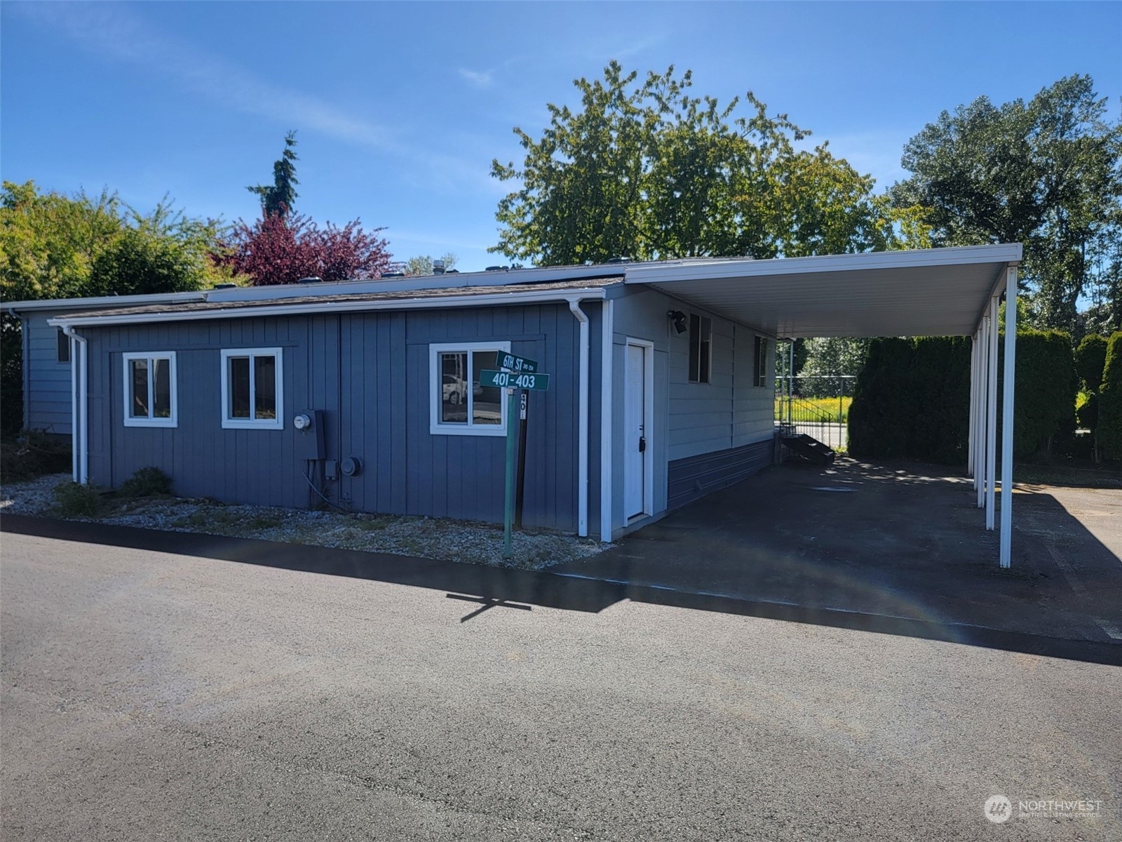 a view of a house with a yard and garage