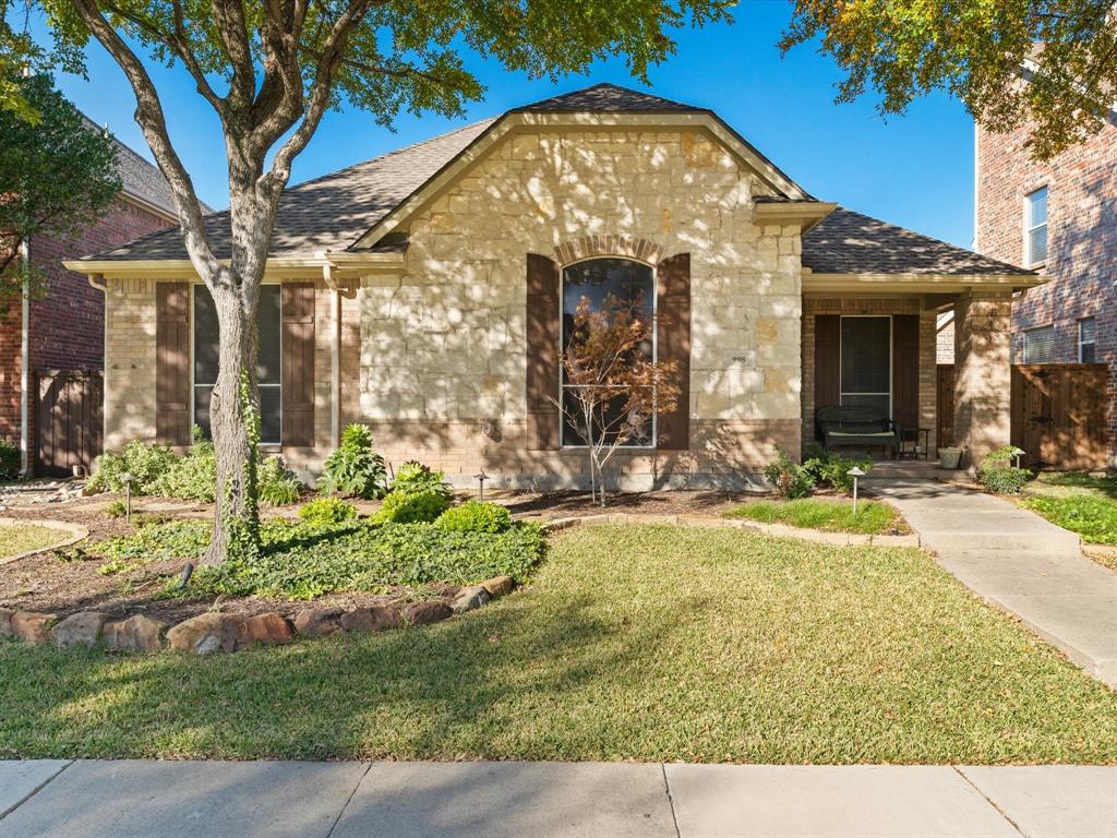 View of front of property with a front yard