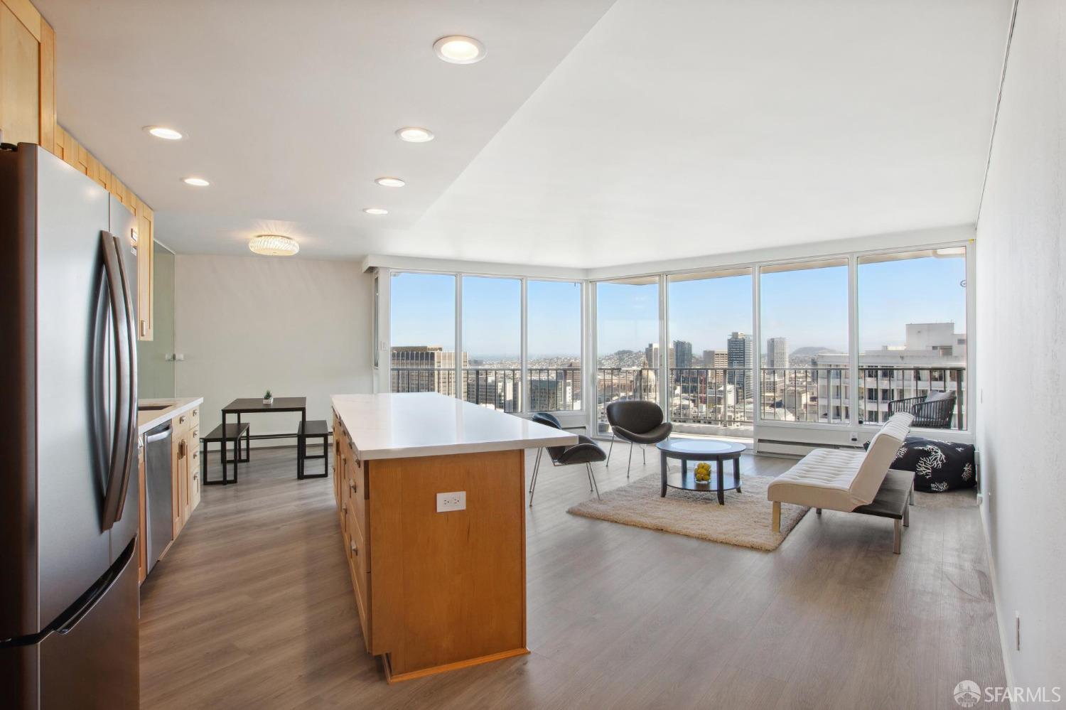 a living room with lots of furniture and a refrigerator