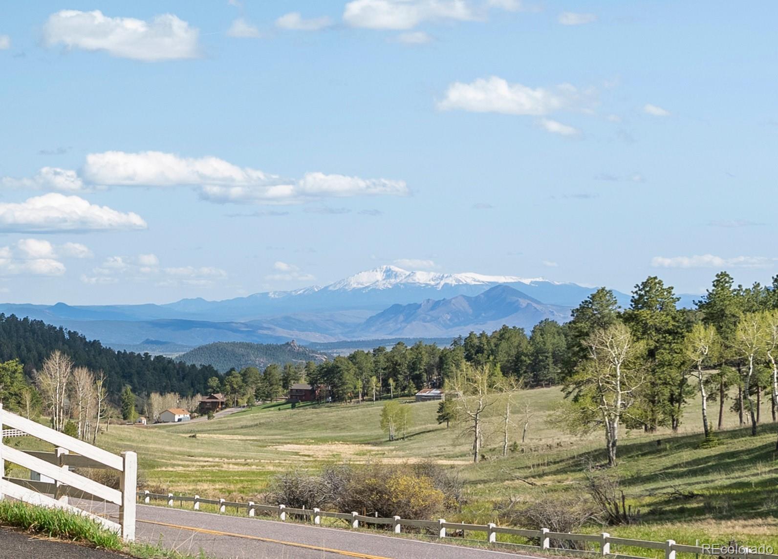 a view of a town with mountains in the background