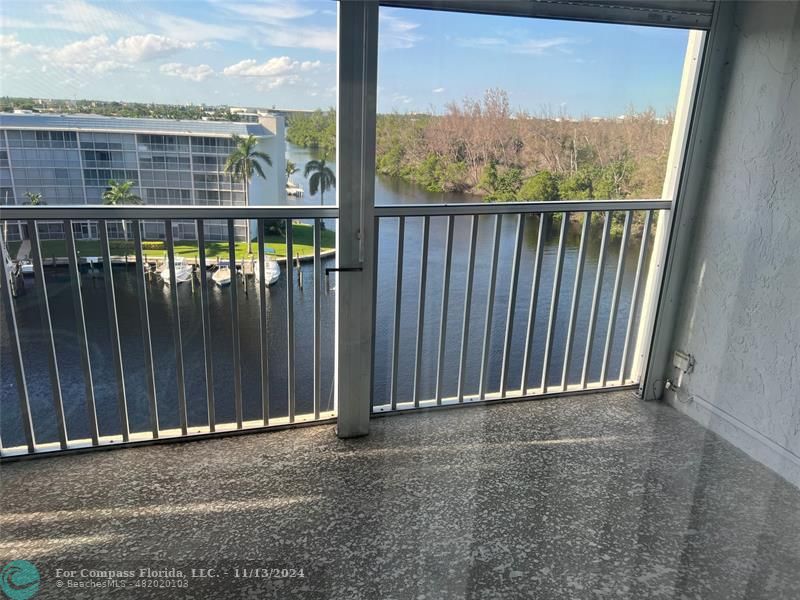 a view of a balcony with an outdoor space