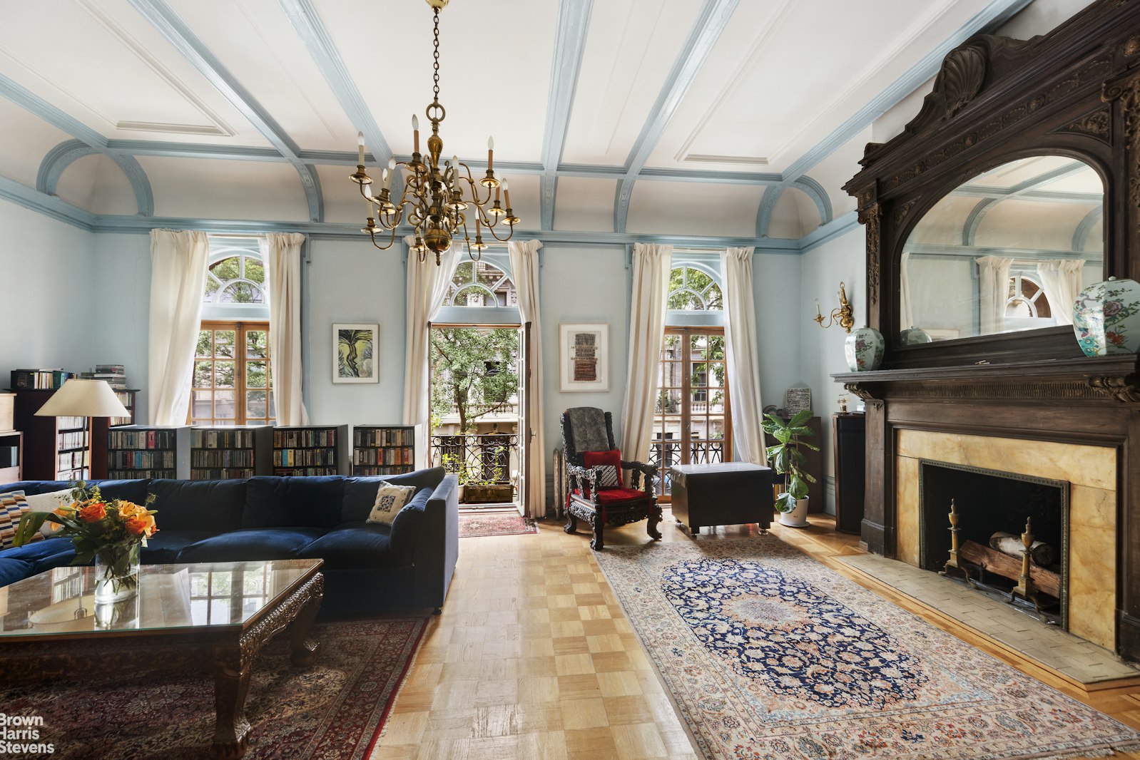 a living room with furniture a window and a fireplace