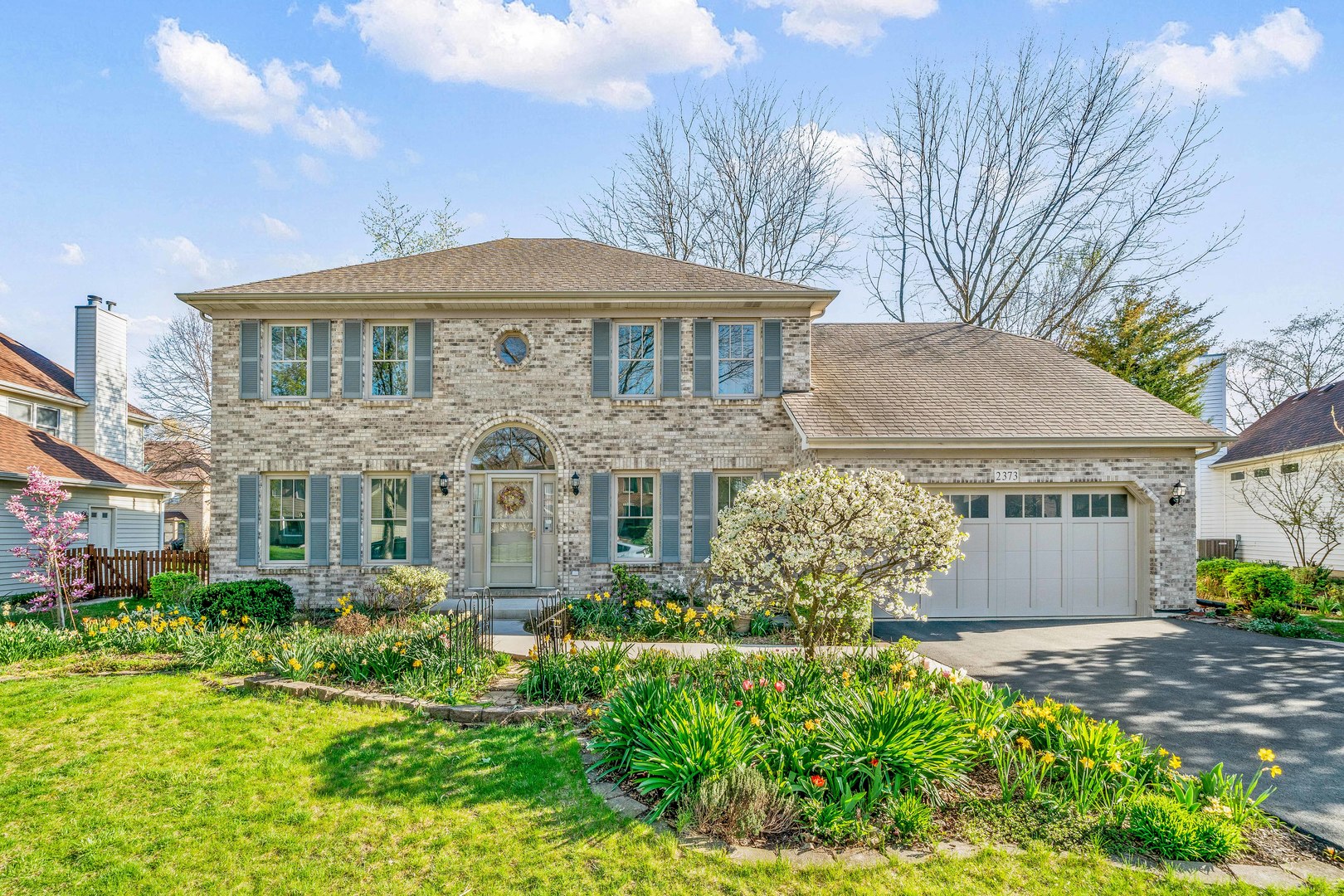 front view of a house with a yard