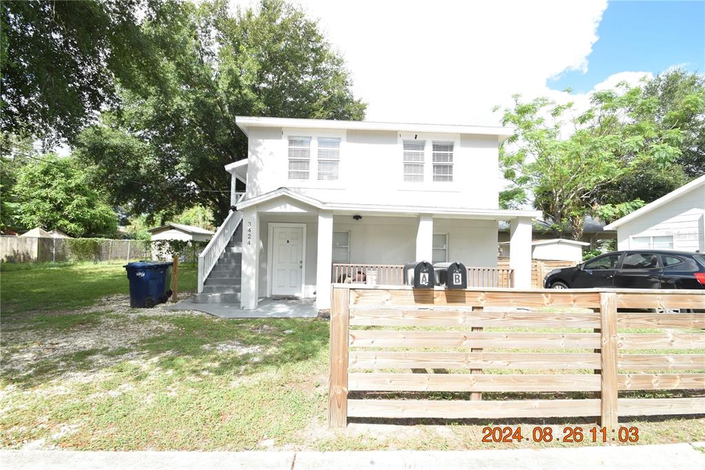 a view of a house with a yard