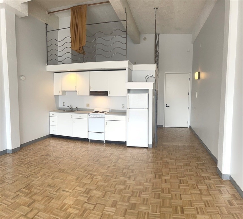 a view of a kitchen with a sink