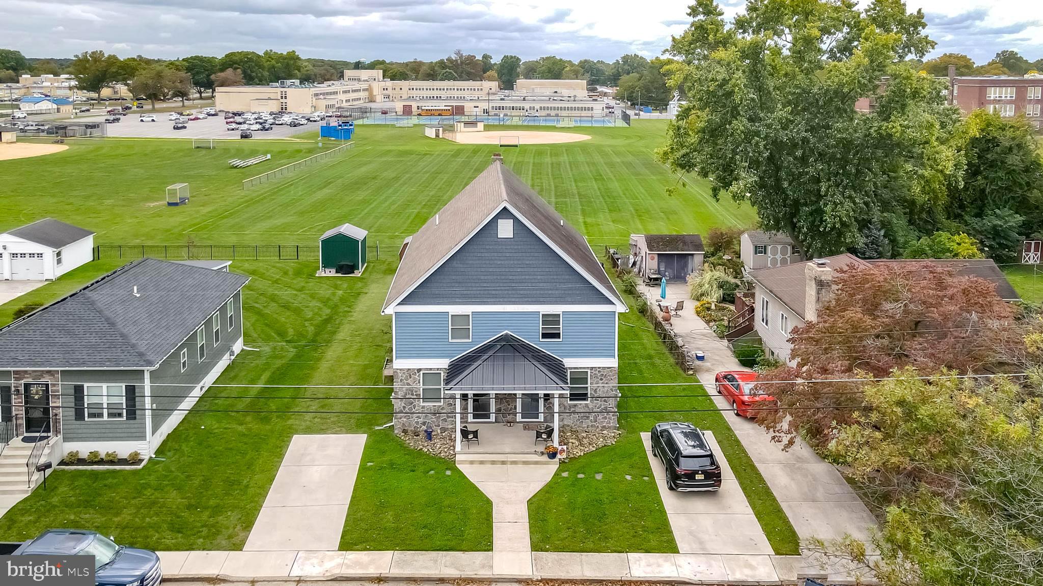 a aerial view of a house with a yard