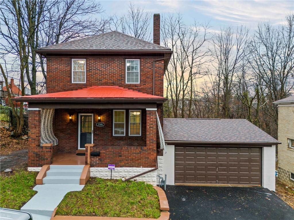 All Brick Colonial with double attached garage!  An impossible find in the city!