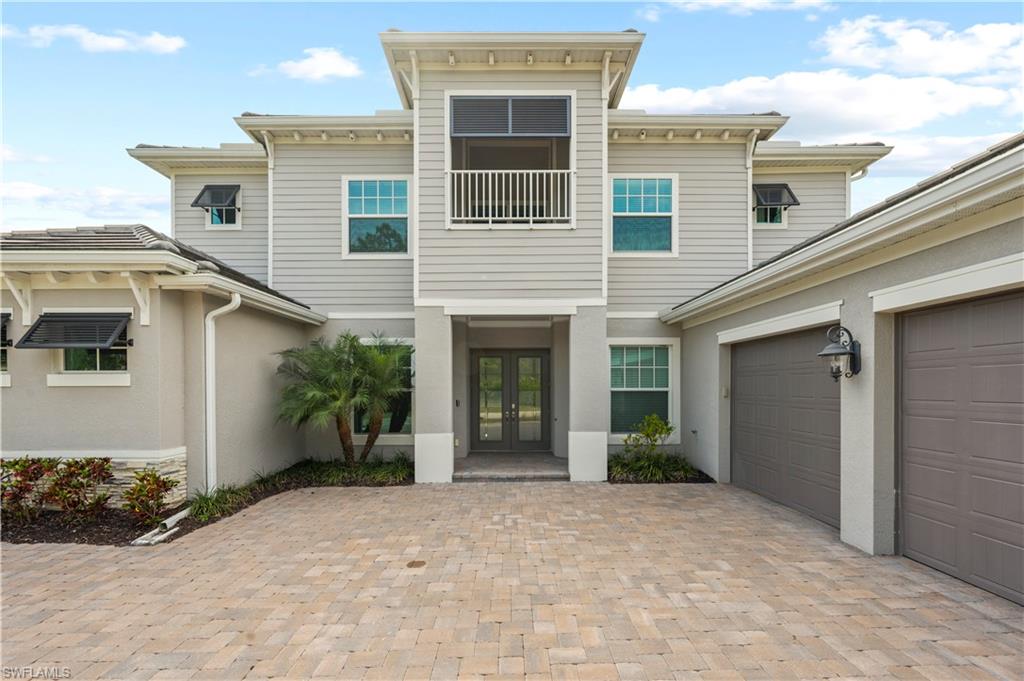 a view of a house with a yard and garage