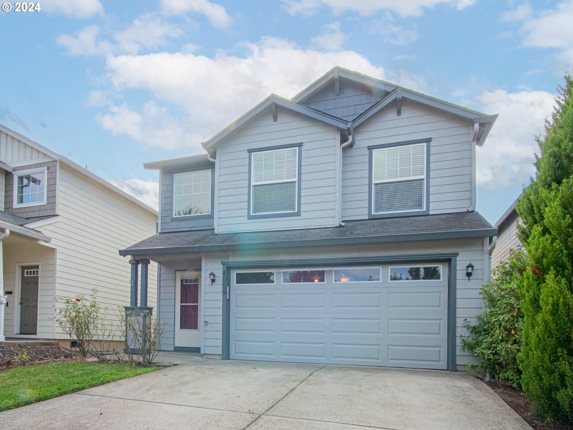 a front view of a house with a garage