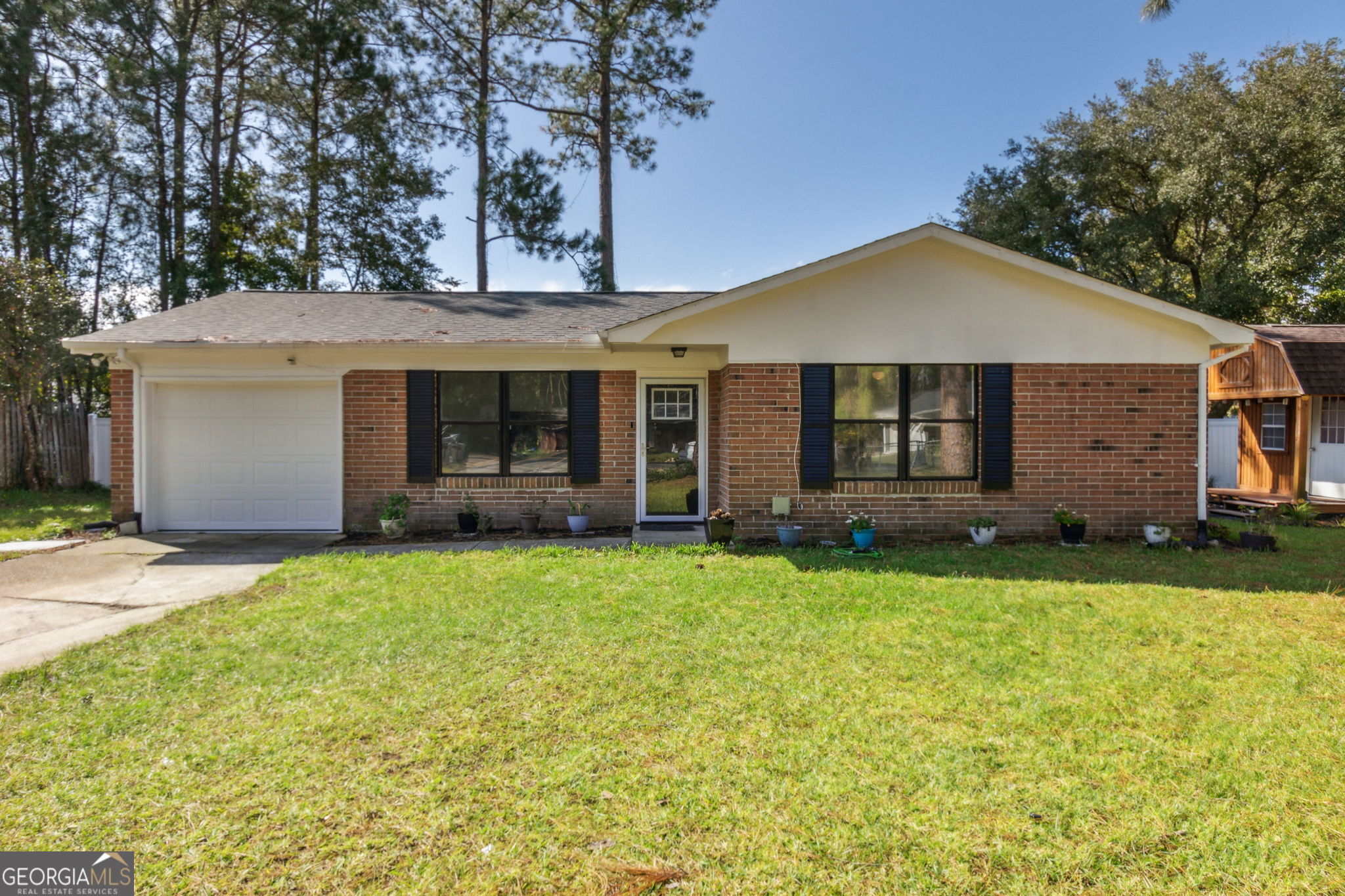 front view of a house with a yard