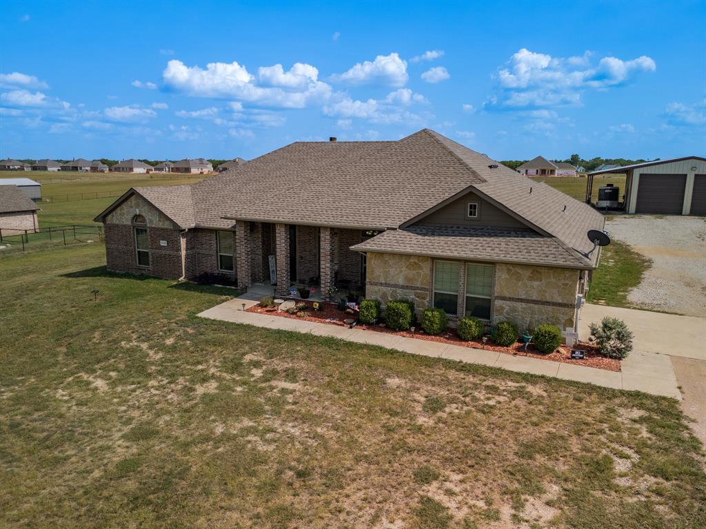 front view of a house with a yard