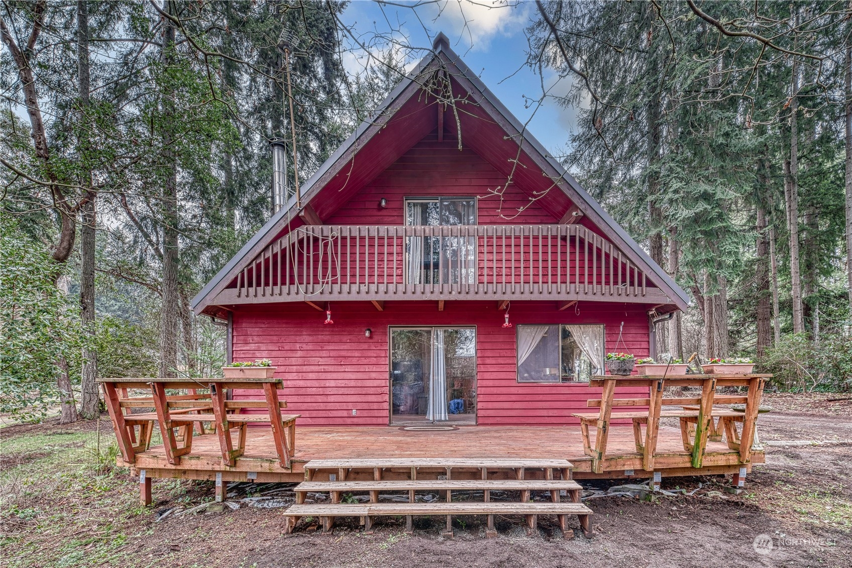 a backyard of a house with table and chairs