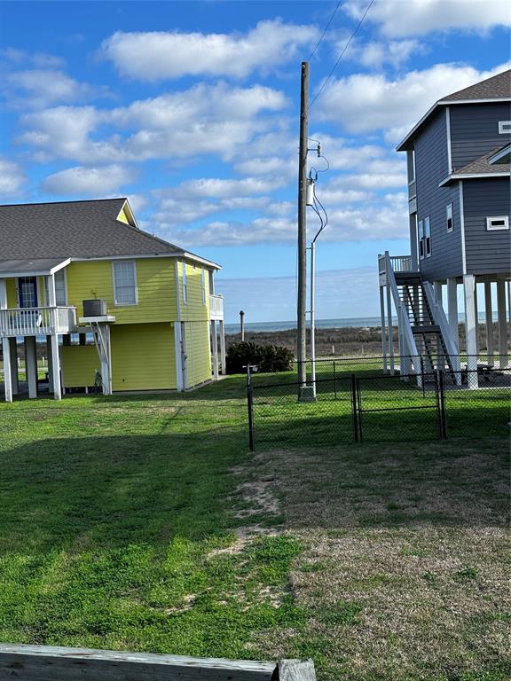 a house view with a play ground in front of it