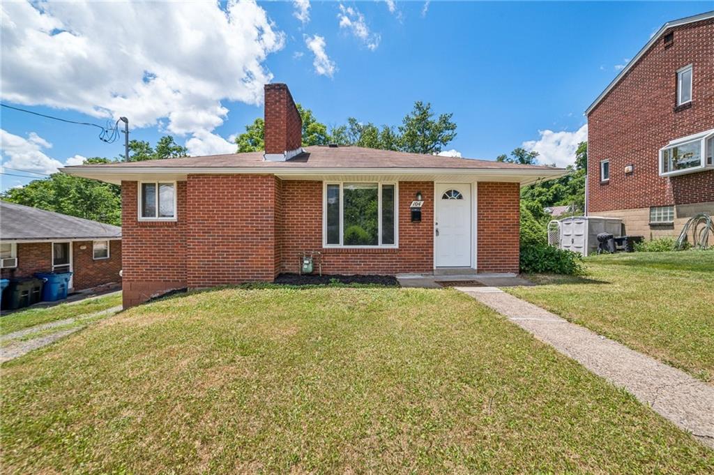 a view of a house with a yard