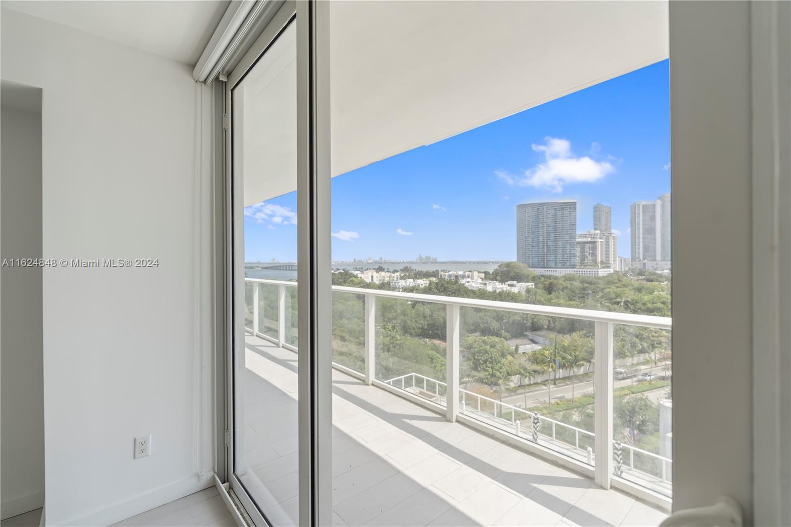 a view of a glass door and a window