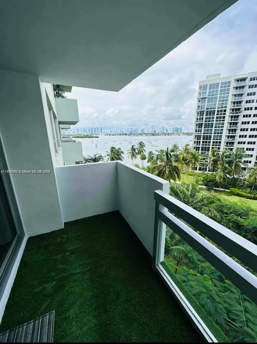 a view of balcony with furniture