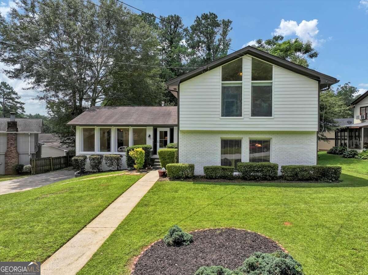 a front view of a house with a yard