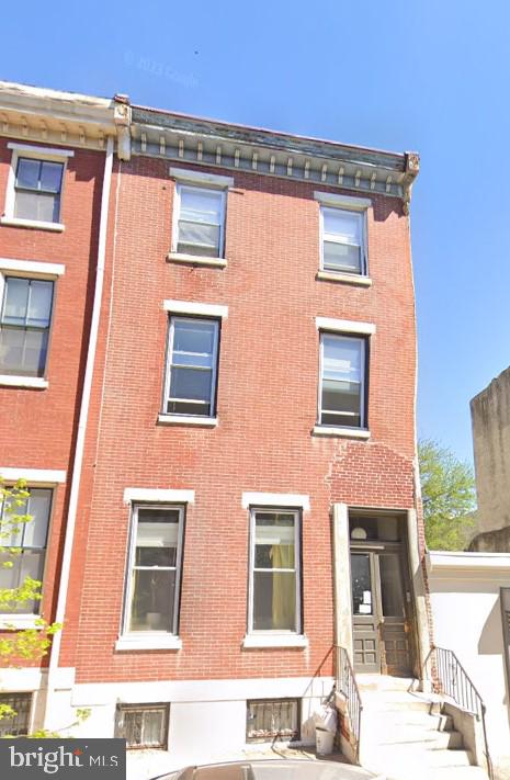 a front view of a multi story residential apartment building