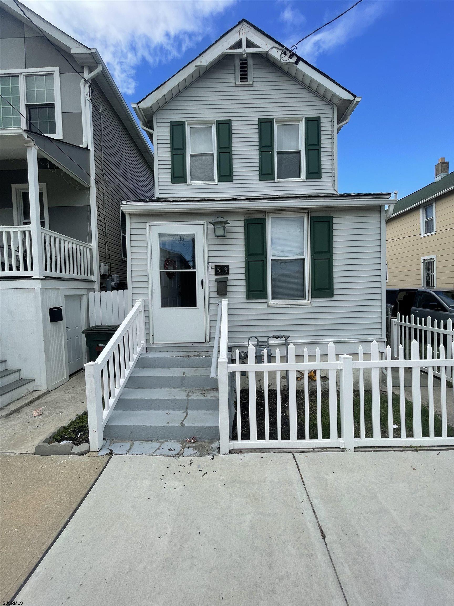 a front view of a house with a porch