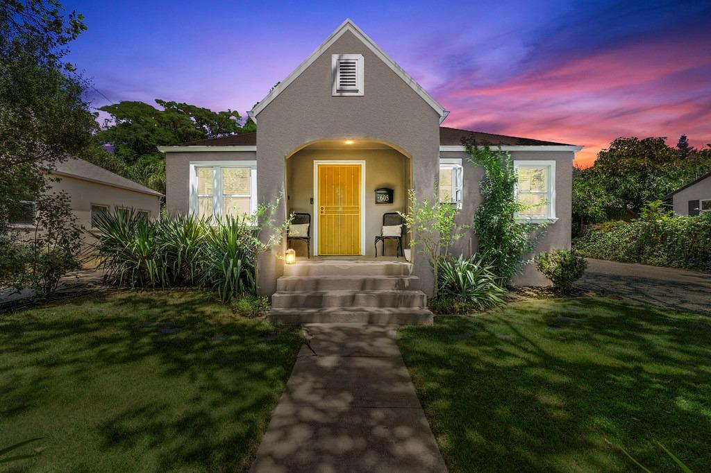 a front view of a house with a yard