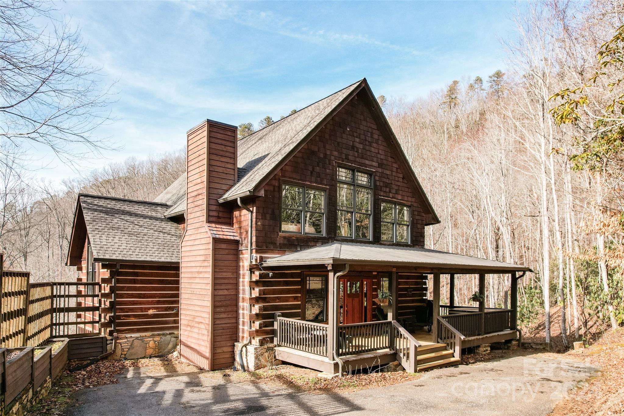 a view of a house with backyard porch and furniture