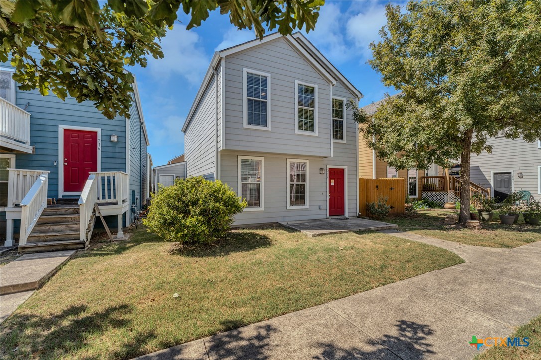 a front view of a house with a yard