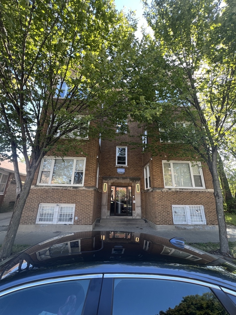 a front view of a house with parking