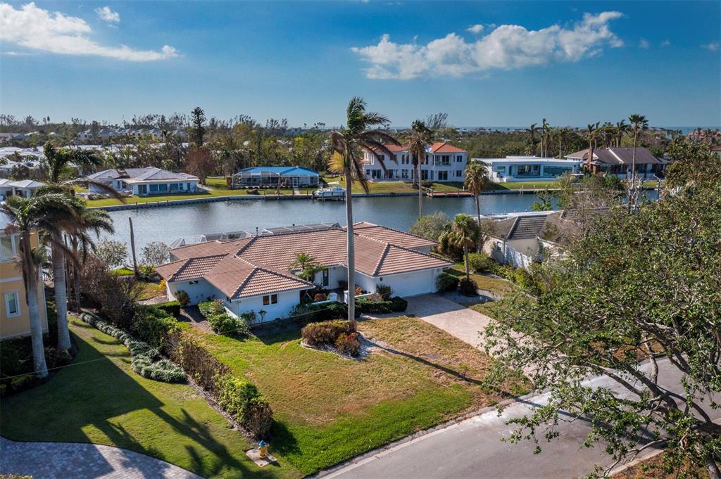 an aerial view of a house with a lake view