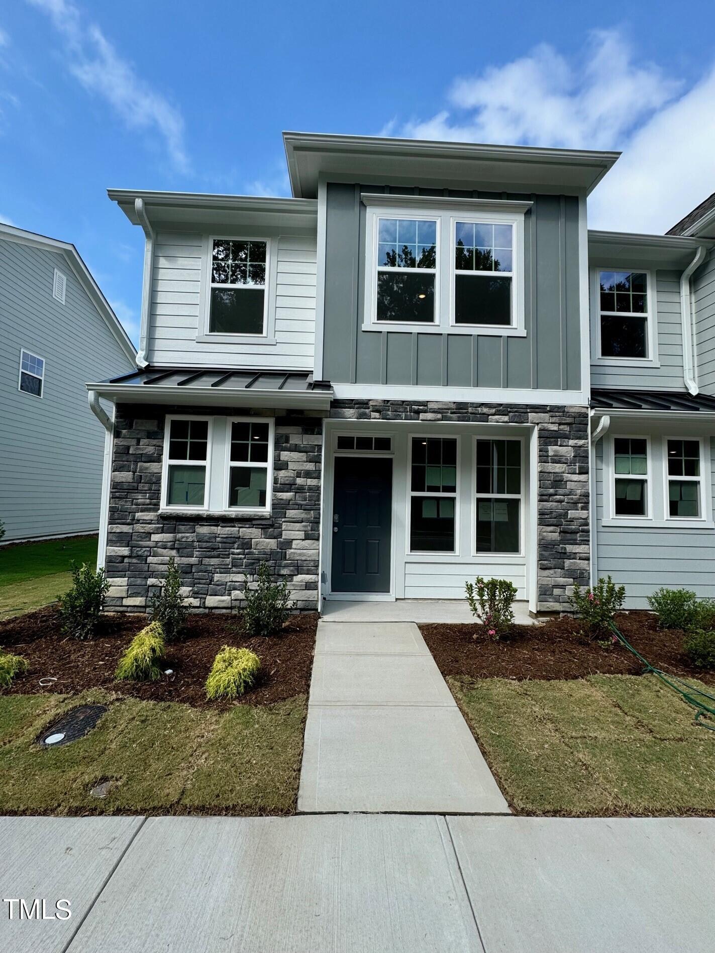 a front view of a house with yard