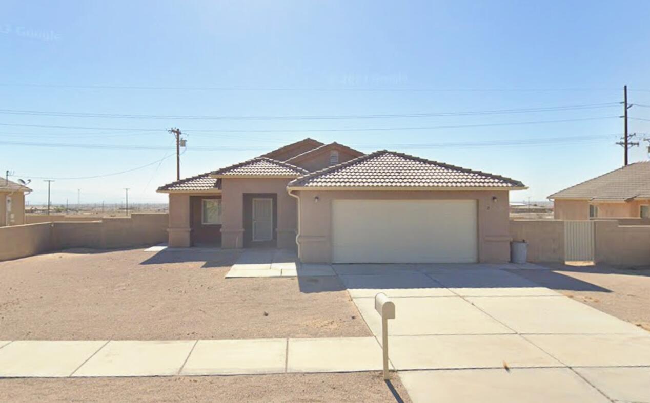 a front view of a house with a garage