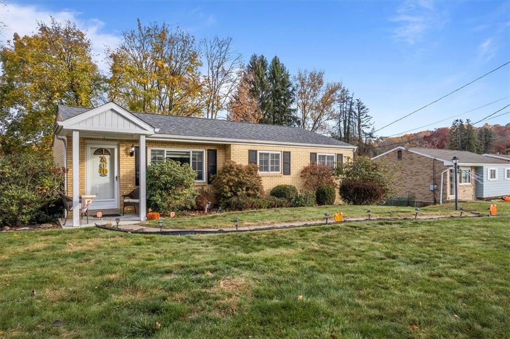 a front view of a house with a yard