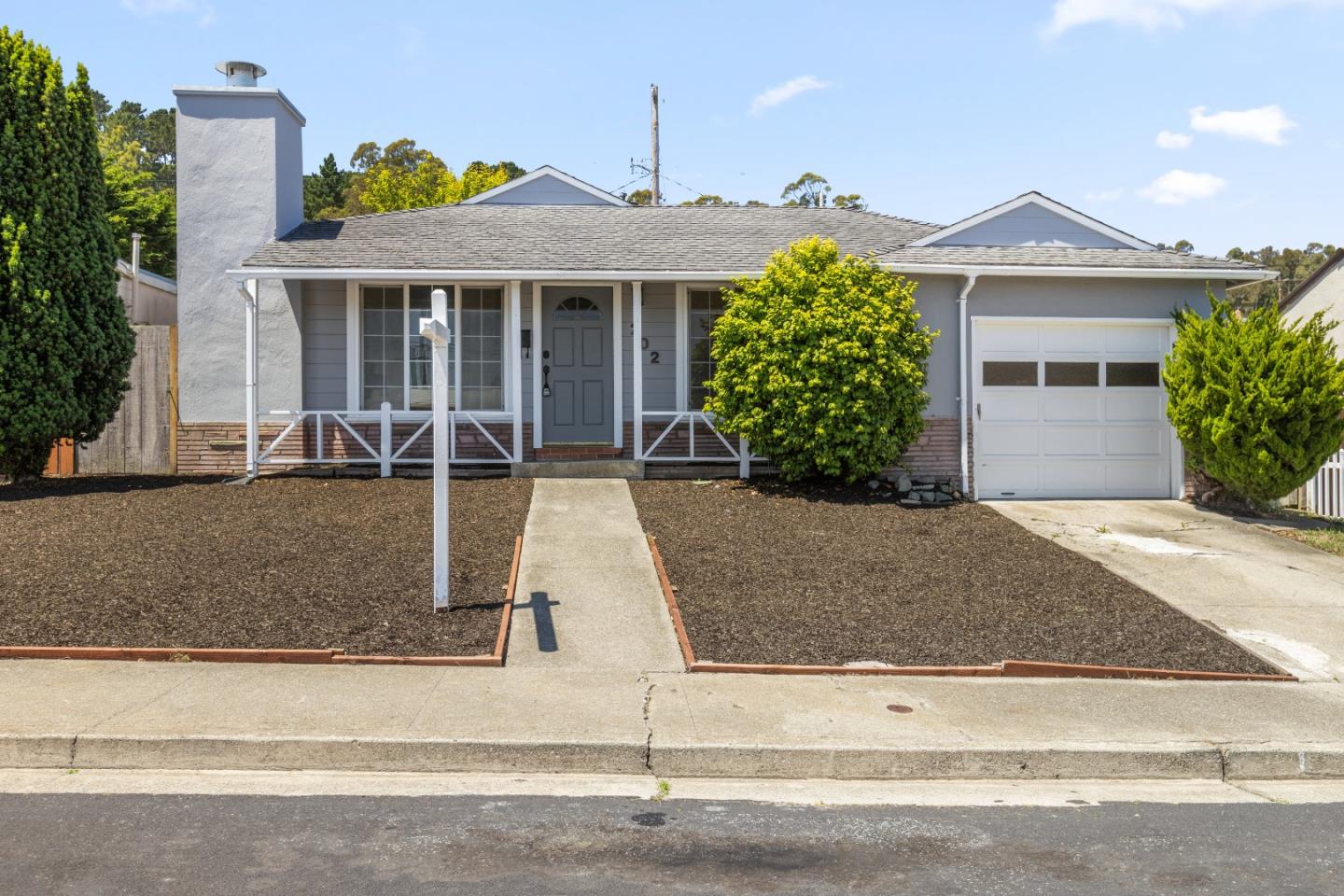 front view of a house and a yard