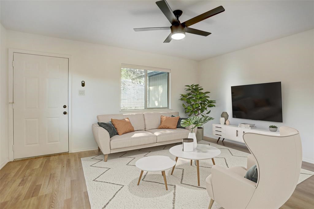 a living room with furniture and a flat screen tv