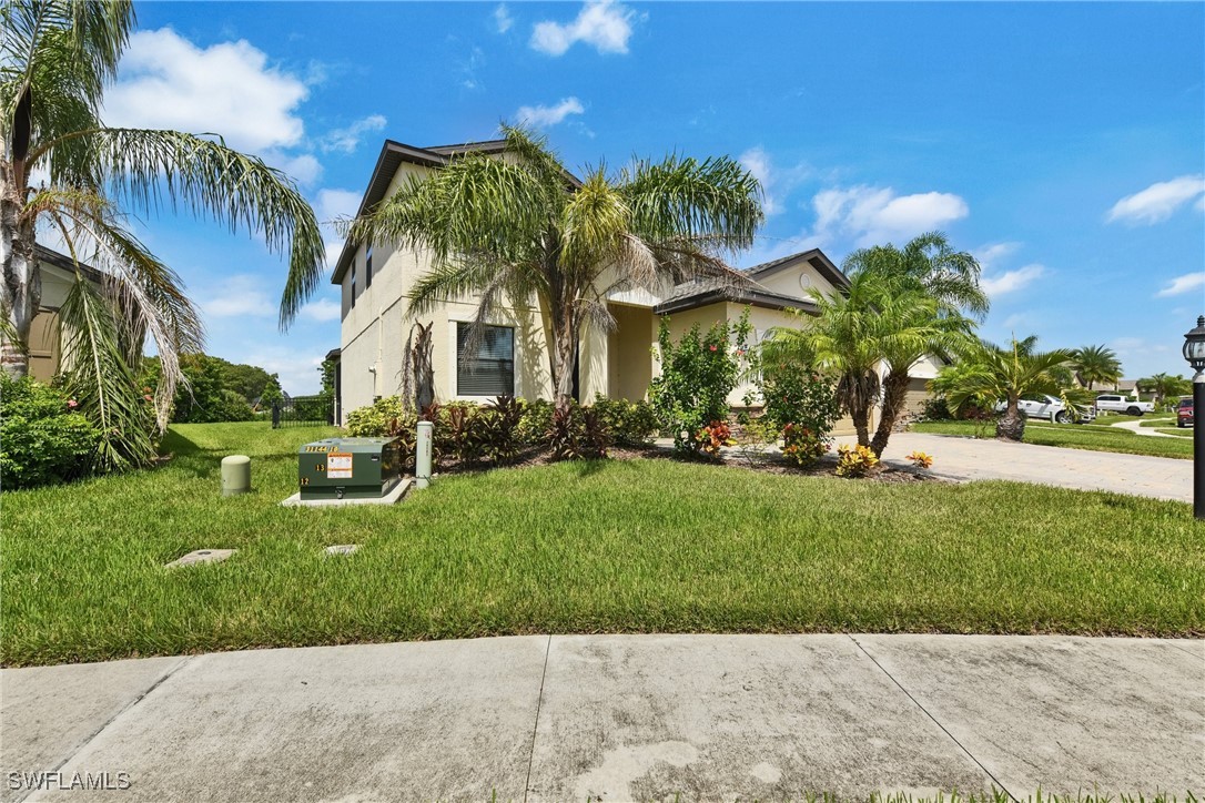 a front view of a house with a garden